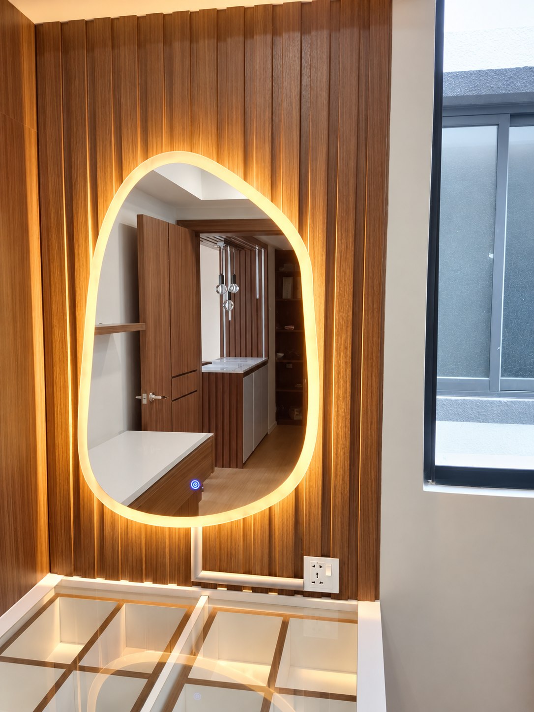 Custom arched Adorable LED mirror installed on a timber feature wall